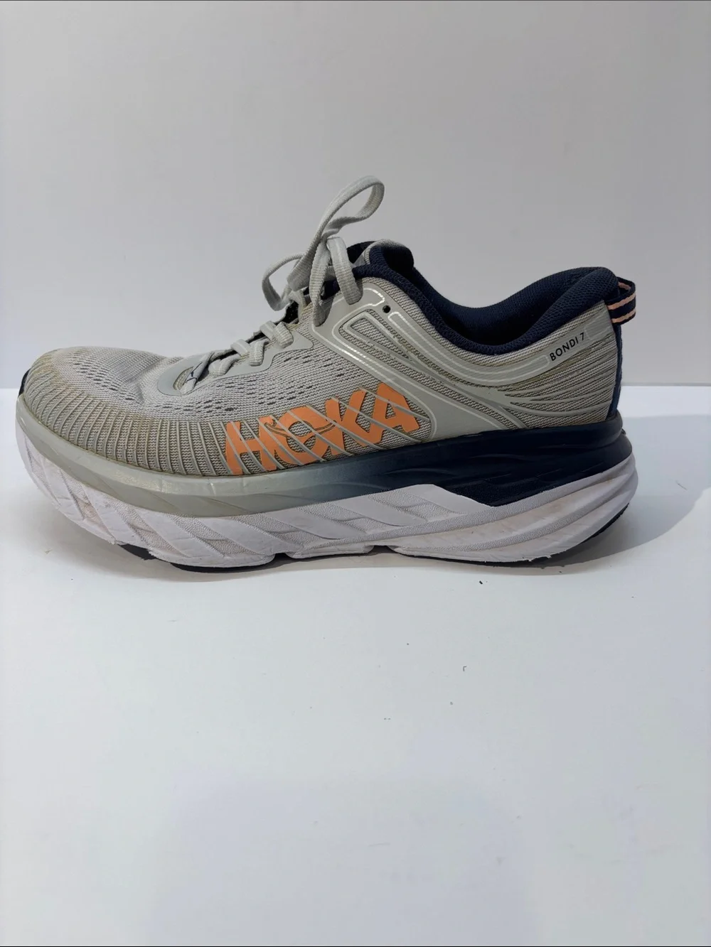 Hoka women’s size 7 gray/peach Bindi 7 style #110531 LRBI in fair condition.